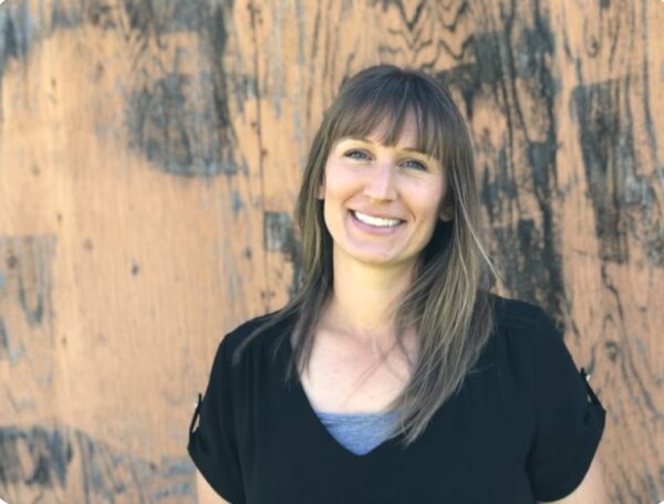 Innovations Academy (IA) second grade teacher Natalie smalls at camera